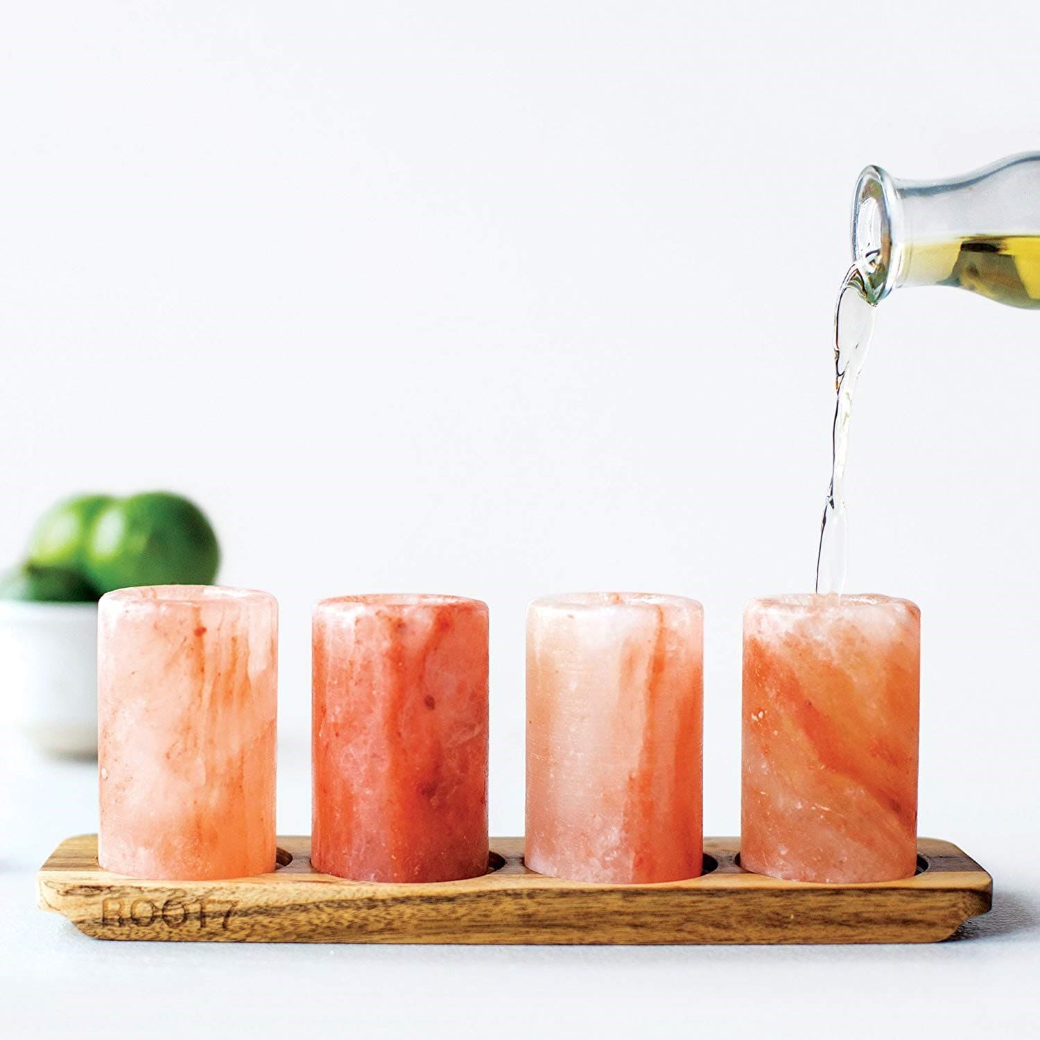 Himalayan pink salt blocks and shot glasses arranged for culinary presentation