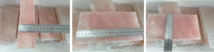 Steel ruler measuring a 5cm (2-inch) thick Himalayan salt block wrapped in POF film, verifying high-heat durability for BBQ wholesale