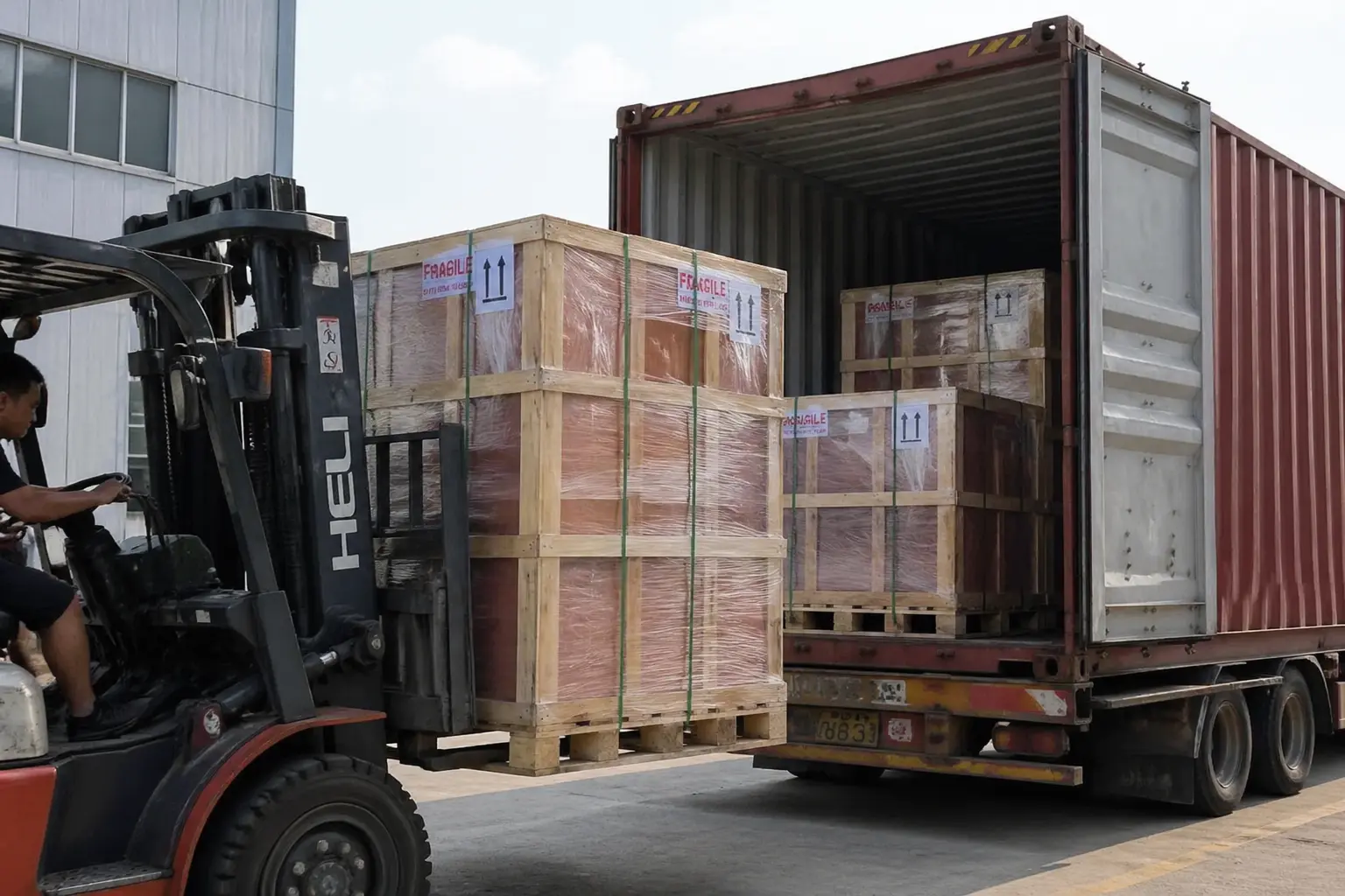 Forklift loading oversized Himalayan salt lamps packed in reinforced wooden crates into a shipping container, showing professional logistics and export-engineered packaging for heavy, fragile items.