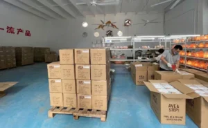 Staff at our salt lamp factory preparing a bulk order of 1-2kg mini Himalayan salt lamps with standardized 8-pack master carton packaging.