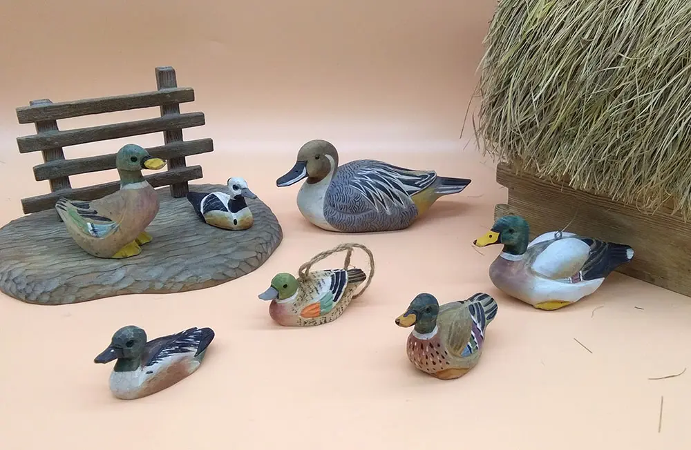 Hand-carved wooden duck family set with large and mini mallard ducks for retail display