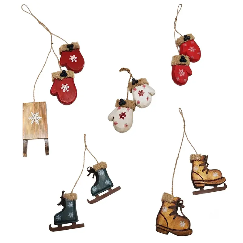 Handcrafted wooden mitten, ice skate and sled Christmas ornaments with snowflake motifs for Nordic-style retail displays