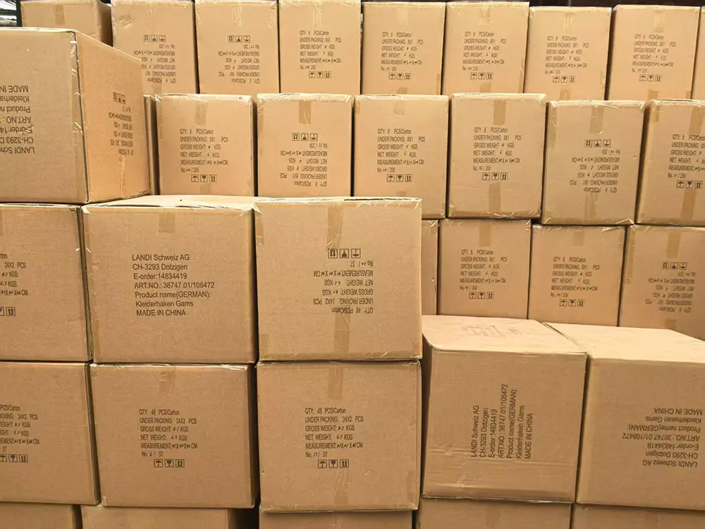 Professional export-ready cardboard shipping cartons for wooden products, stacked and clearly labeled for international wholesale distribution.