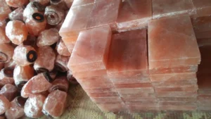 Stacks of shrink-wrapped wholesale Himalayan salt bricks ready for bulk B2B export.