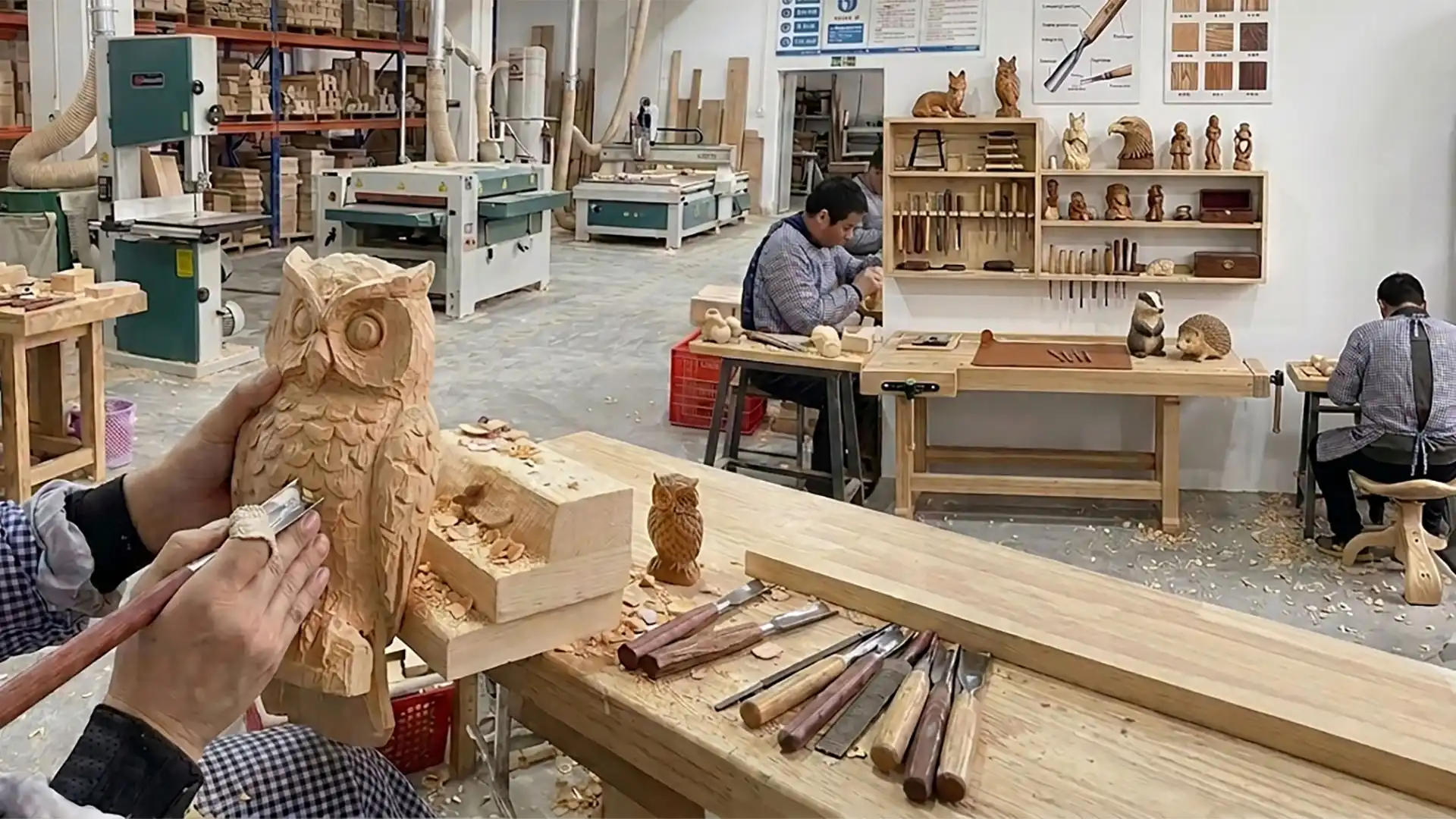 Handcrafted wooden owl carvings in the Ever Creation factory workshop