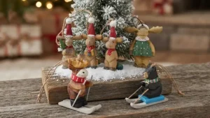 Wooden moose Christmas ornaments and skiing bear figurines for holiday decor