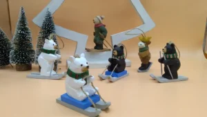Hand-painted wooden skiing bear and animal ornaments during production